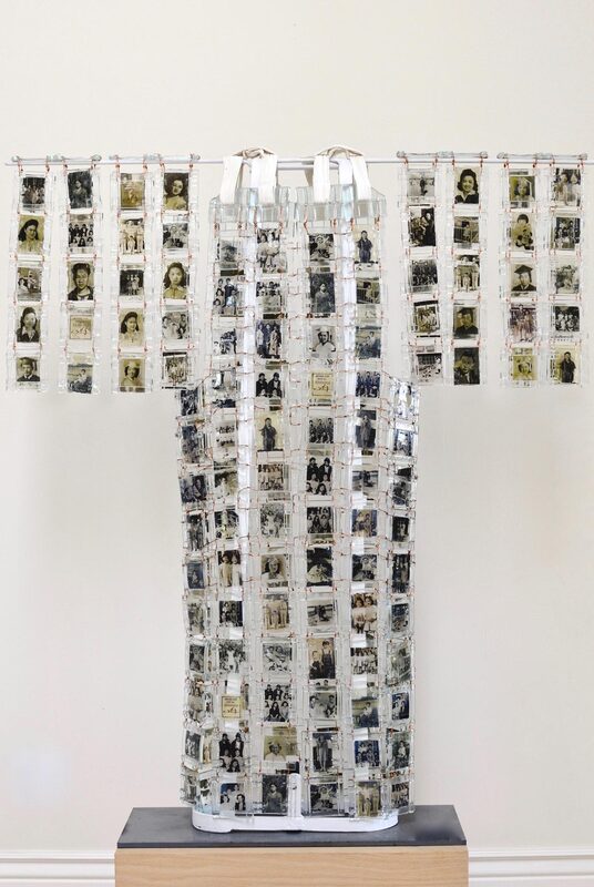 Photo of a collection of portrait photographs arranged to resemble a kimono